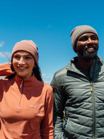 A man and a lady hiking together wearing gear from Hi-Tech